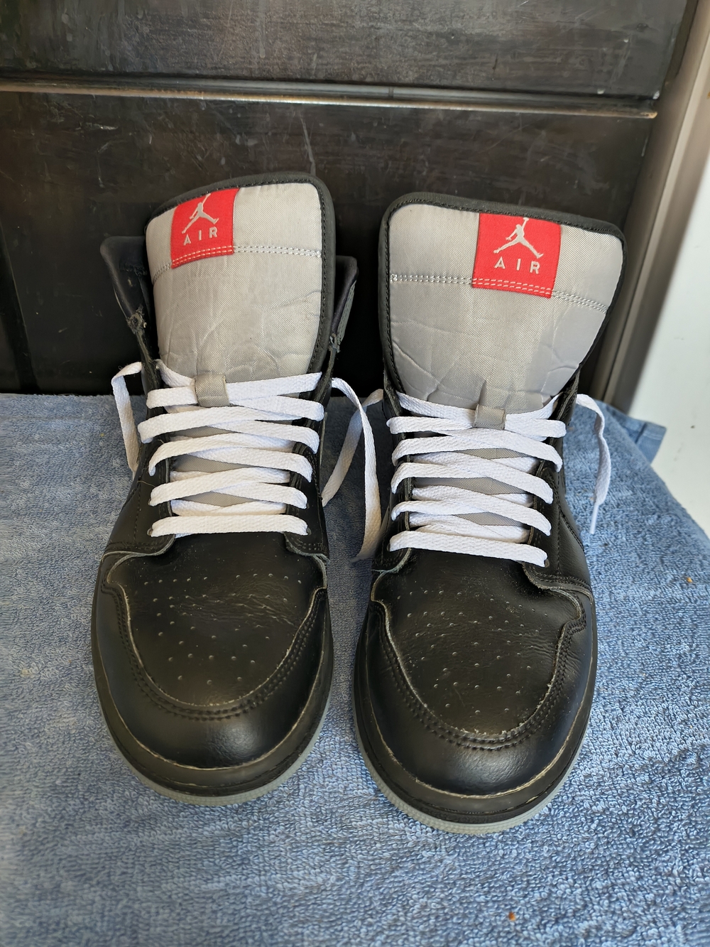 Jordan Black and Gray High-Top Sneakers with Red Tongue Logo
